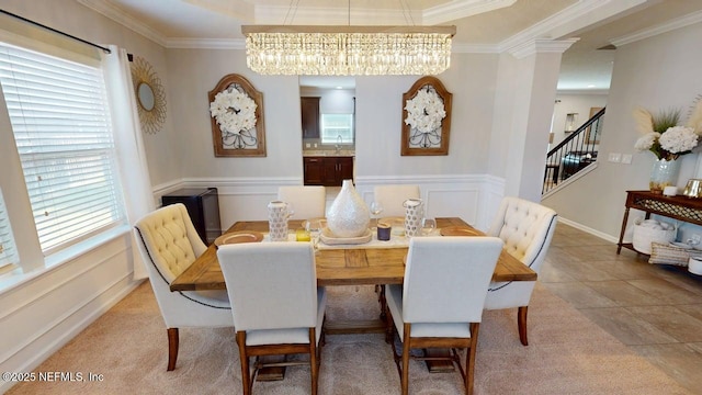 15717 Basil Creek Ct, Jacksonville, FL 32218 - dining area featuring ornamental molding, a chandelier, stairs, and wainscoting
