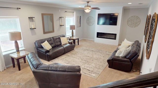 15717 Basil Creek Ct, Jacksonville, FL 32218 - living room featuring light colored carpet, ornamental molding, ceiling fan, a fireplace, and baseboards