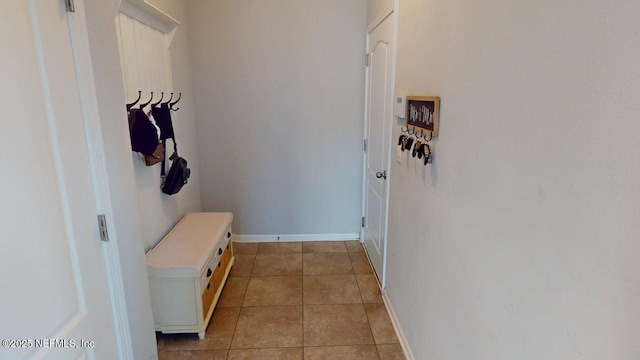 15717 Basil Creek Ct, Jacksonville, FL 32218 - mudroom featuring baseboards and light tile patterned flooring