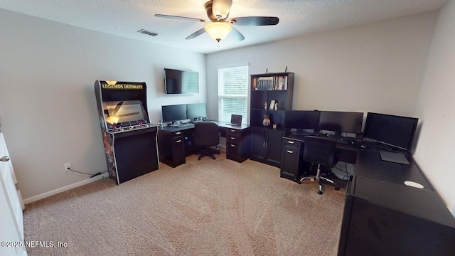 15717 Basil Creek Ct, Jacksonville, FL 32218 - office area featuring ceiling fan, light carpet, a textured ceiling, and baseboards