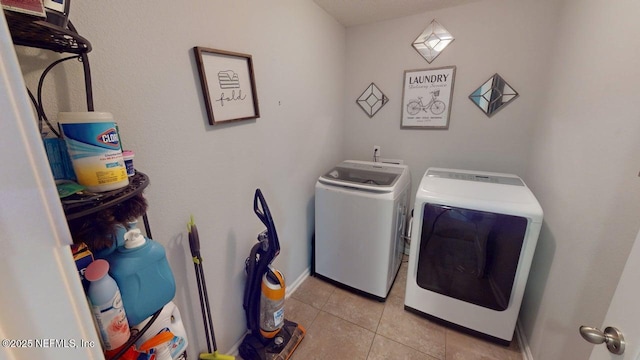 15717 Basil Creek Ct, Jacksonville, FL 32218 - laundry area with independent washer and dryer and light tile patterned floors