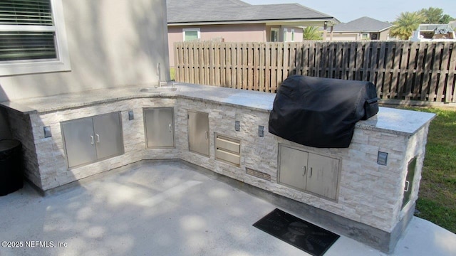 15717 Basil Creek Ct, Jacksonville, FL 32218 - view of patio / terrace with an outdoor kitchen and a sink