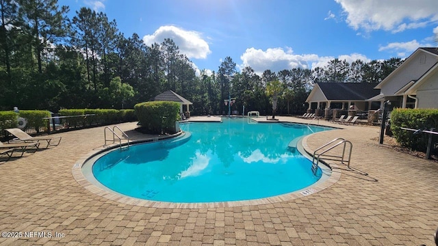 15717 Basil Creek Ct, Jacksonville, FL 32218 - community pool featuring a patio area and a gazebo