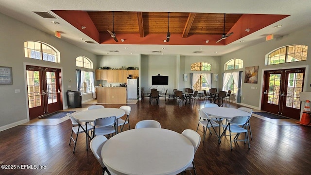 15717 Basil Creek Ct, Jacksonville, FL 32218 - dining area with french doors, wooden ceiling with exposed beams, wood finished floors, a high ceiling, and baseboards