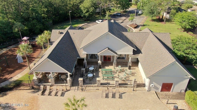 15717 Basil Creek Ct, Jacksonville, FL 32218 - view of front facade with a shingled roof and a patio area