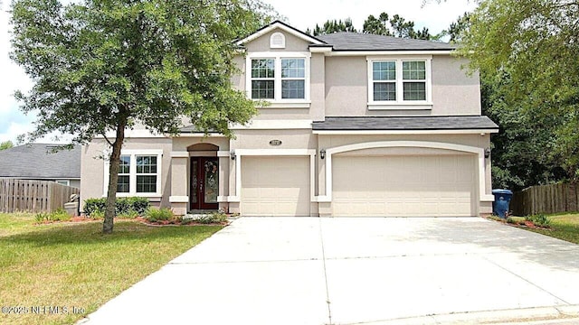 15717 Basil Creek Ct, Jacksonville, FL 32218 - traditional home featuring an attached garage, stucco siding, and driveway