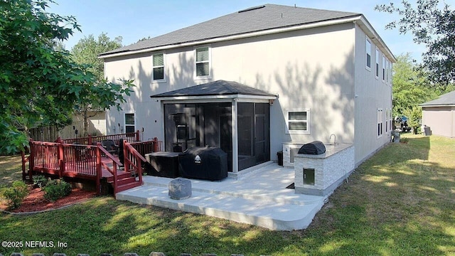 15717 Basil Creek Ct, Jacksonville, FL 32218 - back of property with a sunroom, a patio area, a lawn, and a deck