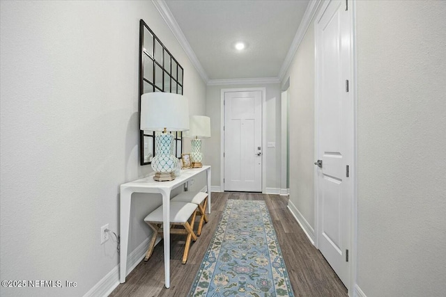entryway featuring crown molding, dark wood-style floors, and baseboards