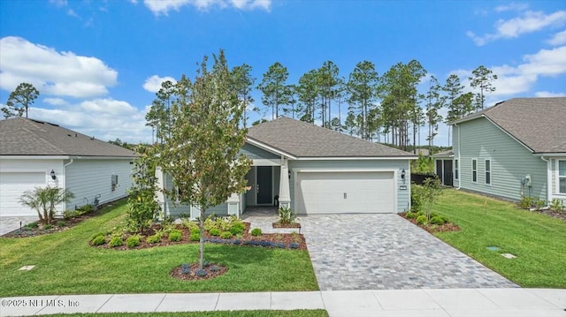 view of front facade featuring decorative driveway, a front lawn, and an attached garage