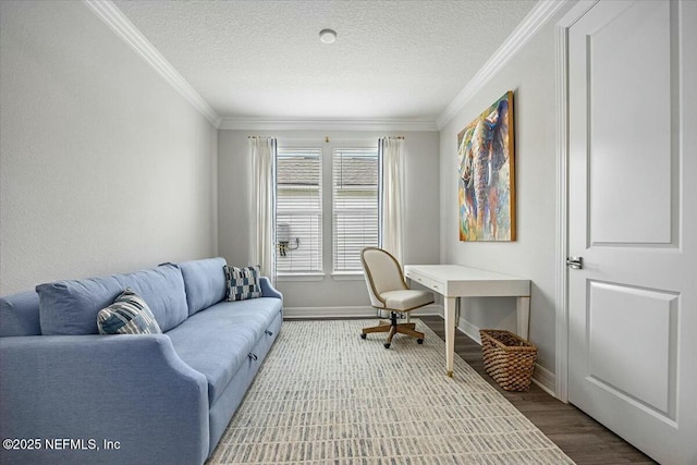 office featuring baseboards, a textured ceiling, and crown molding
