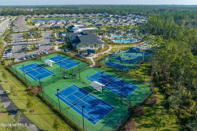 aerial view with a residential view and a wooded view