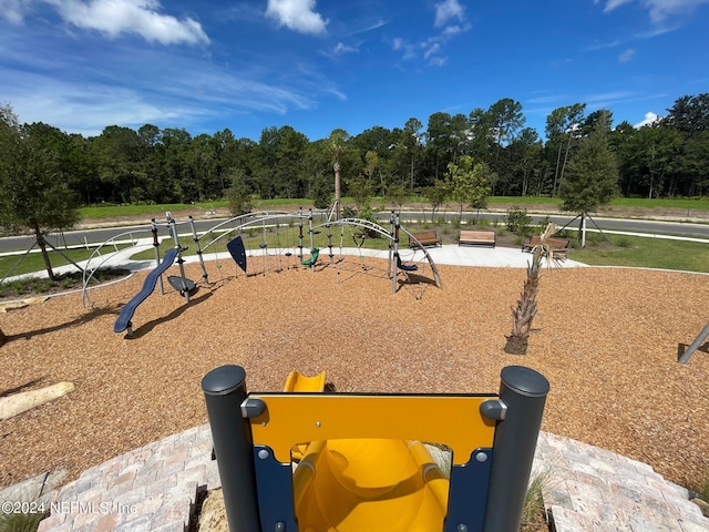 view of property's community featuring playground community