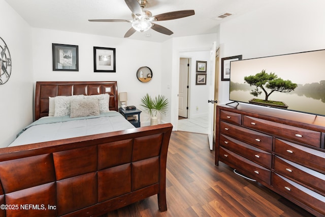 bedroom featuring dark wood-type flooring and visible vents