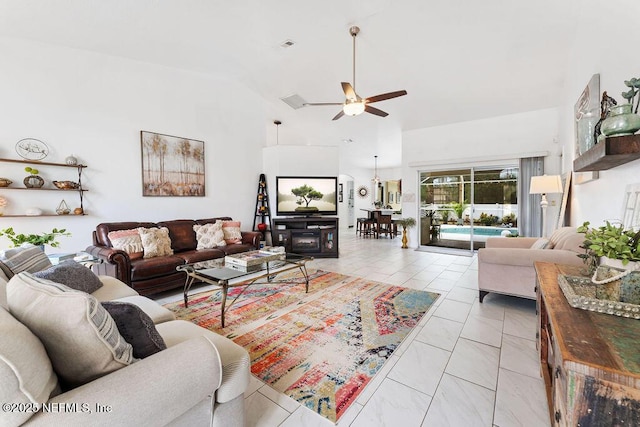 living area featuring a ceiling fan and high vaulted ceiling