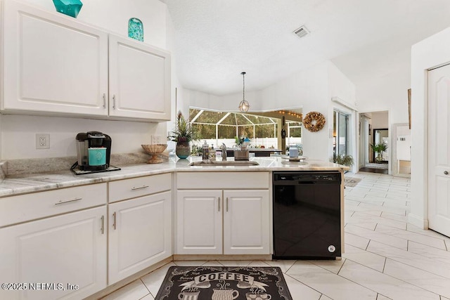 kitchen with white cabinets, a sink, visible vents, dishwasher, and vaulted ceiling
