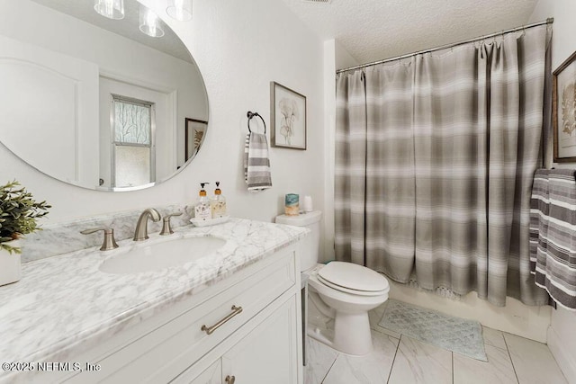 bathroom with toilet, a textured ceiling, and vanity