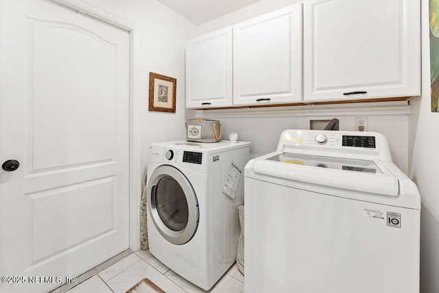 laundry room featuring cabinet space and washing machine and dryer