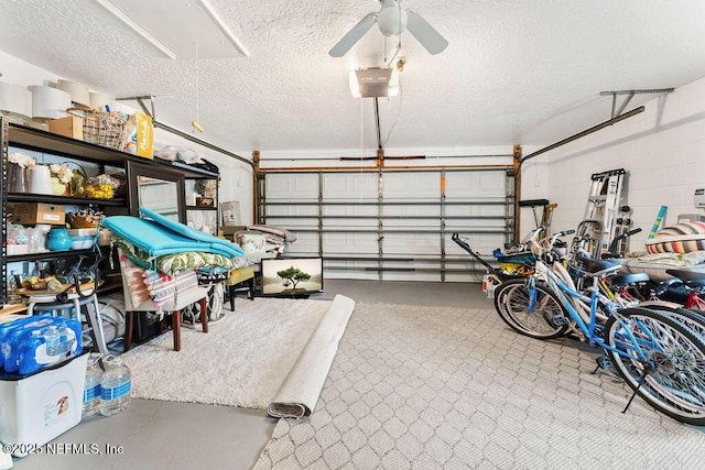 garage featuring ceiling fan and a garage door opener