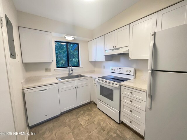 kitchen with white cabinetry, a sink, electric panel, under cabinet range hood, and white appliances