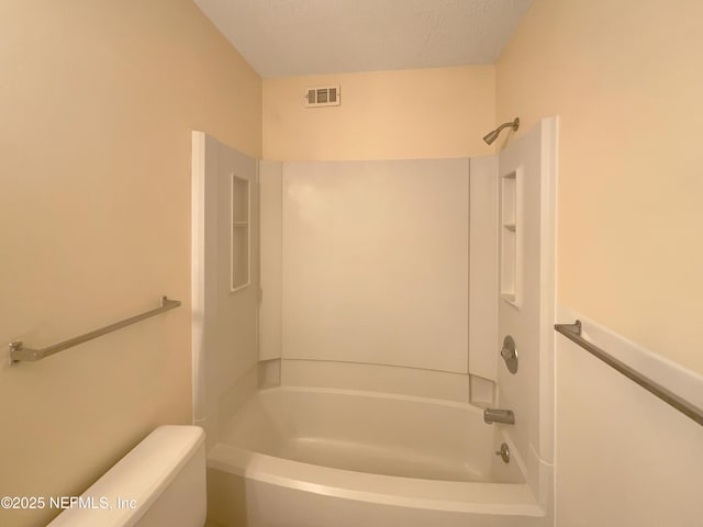 full bath featuring a textured ceiling, visible vents, toilet, and  shower combination