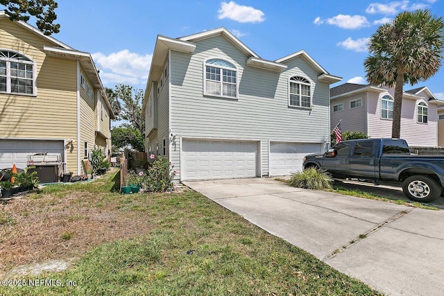 view of property exterior featuring a garage and driveway