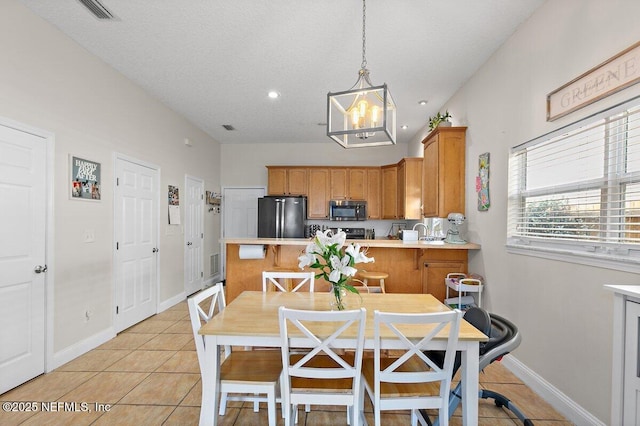 dining room featuring visible vents, light tile patterned floors, baseboards, an inviting chandelier, and recessed lighting