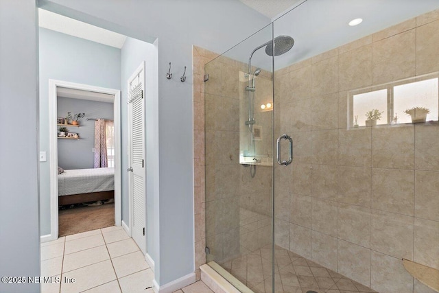 ensuite bathroom with plenty of natural light, tile patterned floors, ensuite bath, and a shower stall