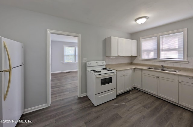 2636 Post St, Jacksonville, FL 32204 - kitchen featuring dark wood finished floors, white appliances, backsplash, and a sink