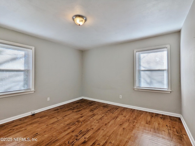 2636 Post St, Jacksonville, FL 32204 - empty room with baseboards, wood finished floors, and a healthy amount of sunlight