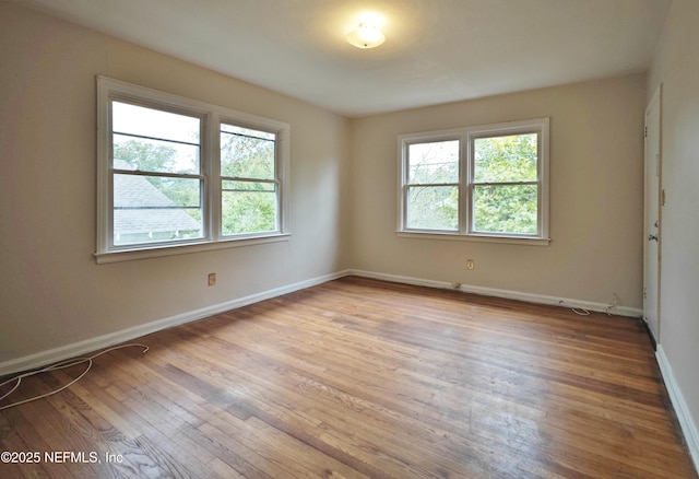 2636 Post St, Jacksonville, FL 32204 - spare room with a wealth of natural light, wood finished floors, and baseboards