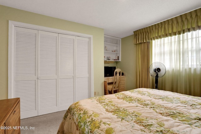 bedroom with carpet floors and a closet