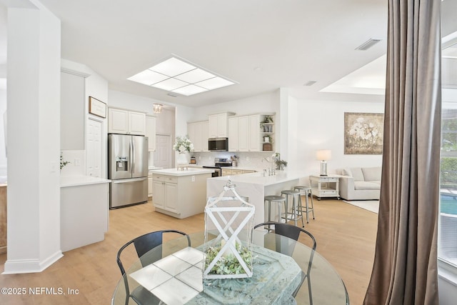 dining room with light wood finished floors