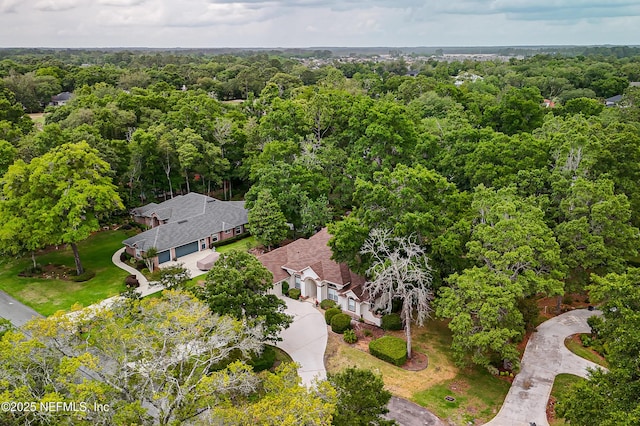 aerial overview of property's location featuring a forest