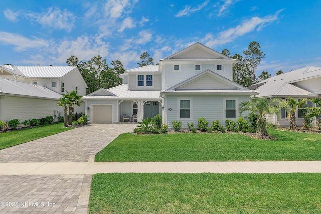 290 Marquesa Cir, Saint Johns, FL 32259 - traditional-style house featuring decorative driveway, metal roof, a front yard, and a garage
