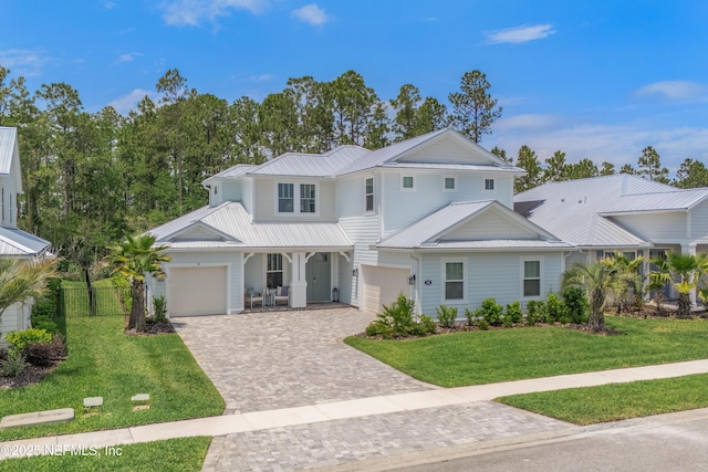 290 Marquesa Cir, Saint Johns, FL 32259 - view of front of property with fence, metal roof, decorative driveway, and a front yard