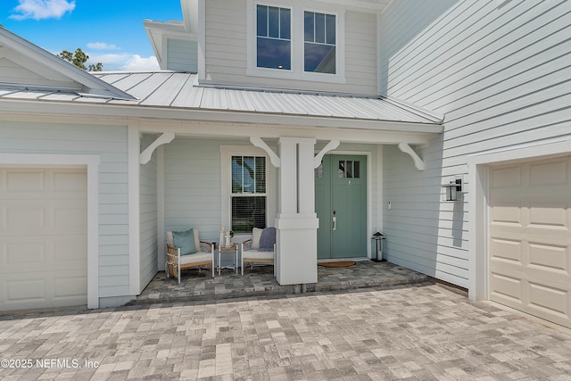290 Marquesa Cir, Saint Johns, FL 32259 - entrance to property with a garage, covered porch, and metal roof
