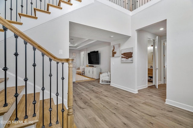290 Marquesa Cir, Saint Johns, FL 32259 - entrance foyer with a towering ceiling, arched walkways, wood finished floors, stairway, and baseboards