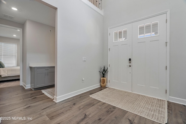 290 Marquesa Cir, Saint Johns, FL 32259 - entryway with baseboards, visible vents, a healthy amount of sunlight, and wood finished floors