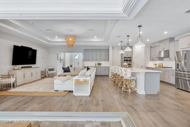 290 Marquesa Cir, Saint Johns, FL 32259 - living area featuring light wood-style floors, recessed lighting, and a tray ceiling