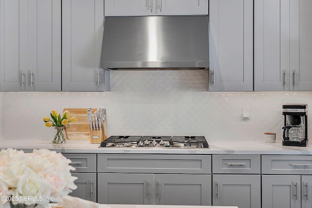 290 Marquesa Cir, Saint Johns, FL 32259 - kitchen featuring exhaust hood, gray cabinetry, stainless steel gas cooktop, and light countertops