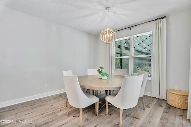 290 Marquesa Cir, Saint Johns, FL 32259 - dining area with baseboards, a notable chandelier, and light wood-style floors