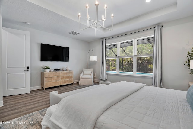 290 Marquesa Cir, Saint Johns, FL 32259 - bedroom featuring visible vents, wood finished floors, baseboards, an inviting chandelier, and recessed lighting