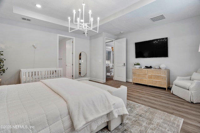 290 Marquesa Cir, Saint Johns, FL 32259 - bedroom with an inviting chandelier, recessed lighting, wood finished floors, and visible vents
