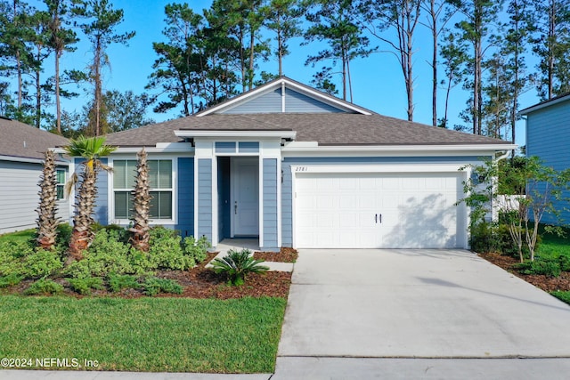 single story home featuring driveway, a shingled roof, and an attached garage