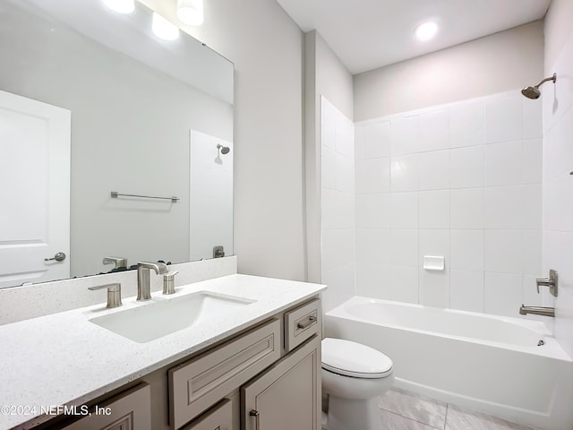 bathroom with shower / bathing tub combination, vanity, and toilet