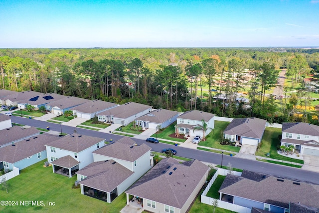 aerial view featuring a residential view and a view of trees