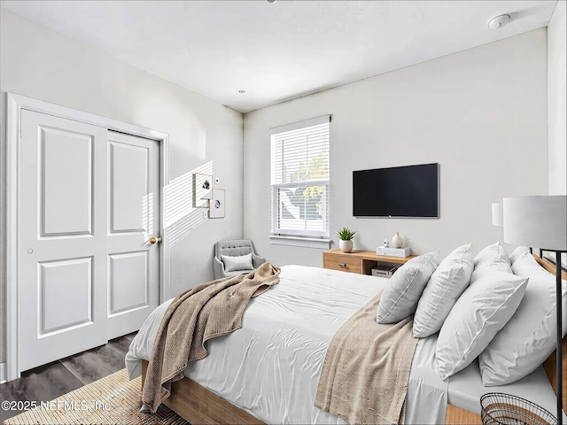 bedroom with wood finished floors