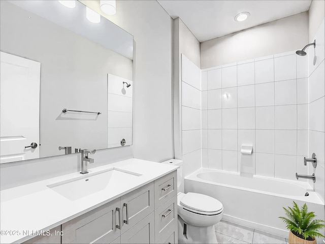 bathroom featuring toilet, shower / bathtub combination, and vanity