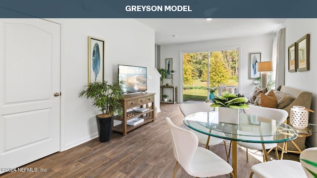 dining space with baseboards and dark wood-style floors