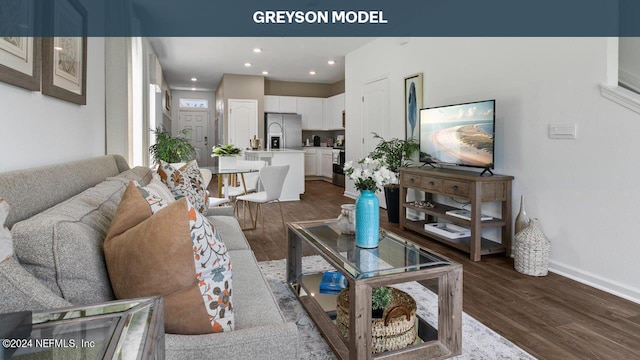 living room featuring recessed lighting, baseboards, and dark wood finished floors